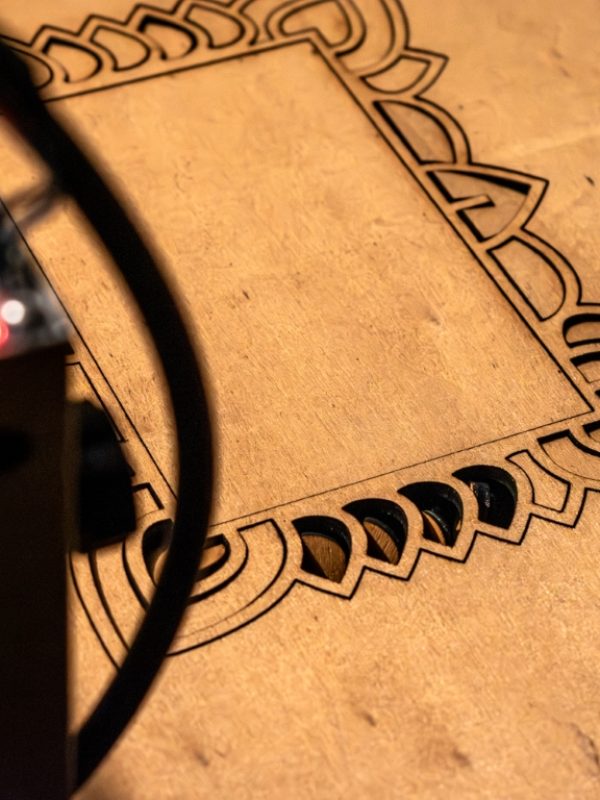 Laser engraving and cutting, using reclaimed wood, upcycling concept