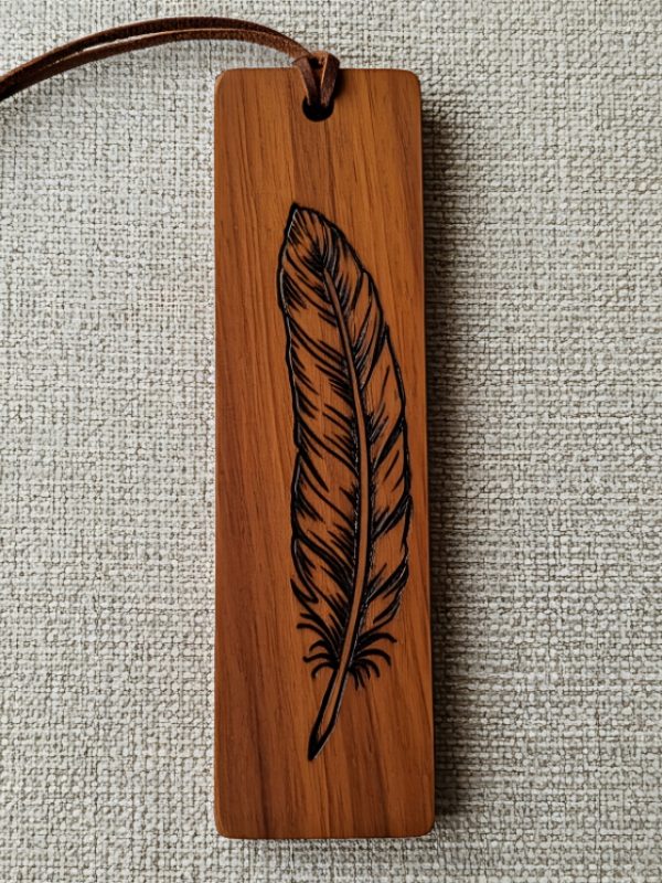 Elegant wooden bookmark laser etched with a detailed feather design and leather cord